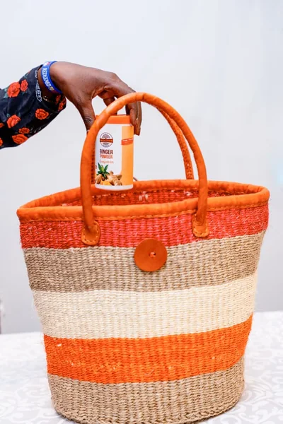 A woven Tanzanian basket filled with Urithi Foods spices