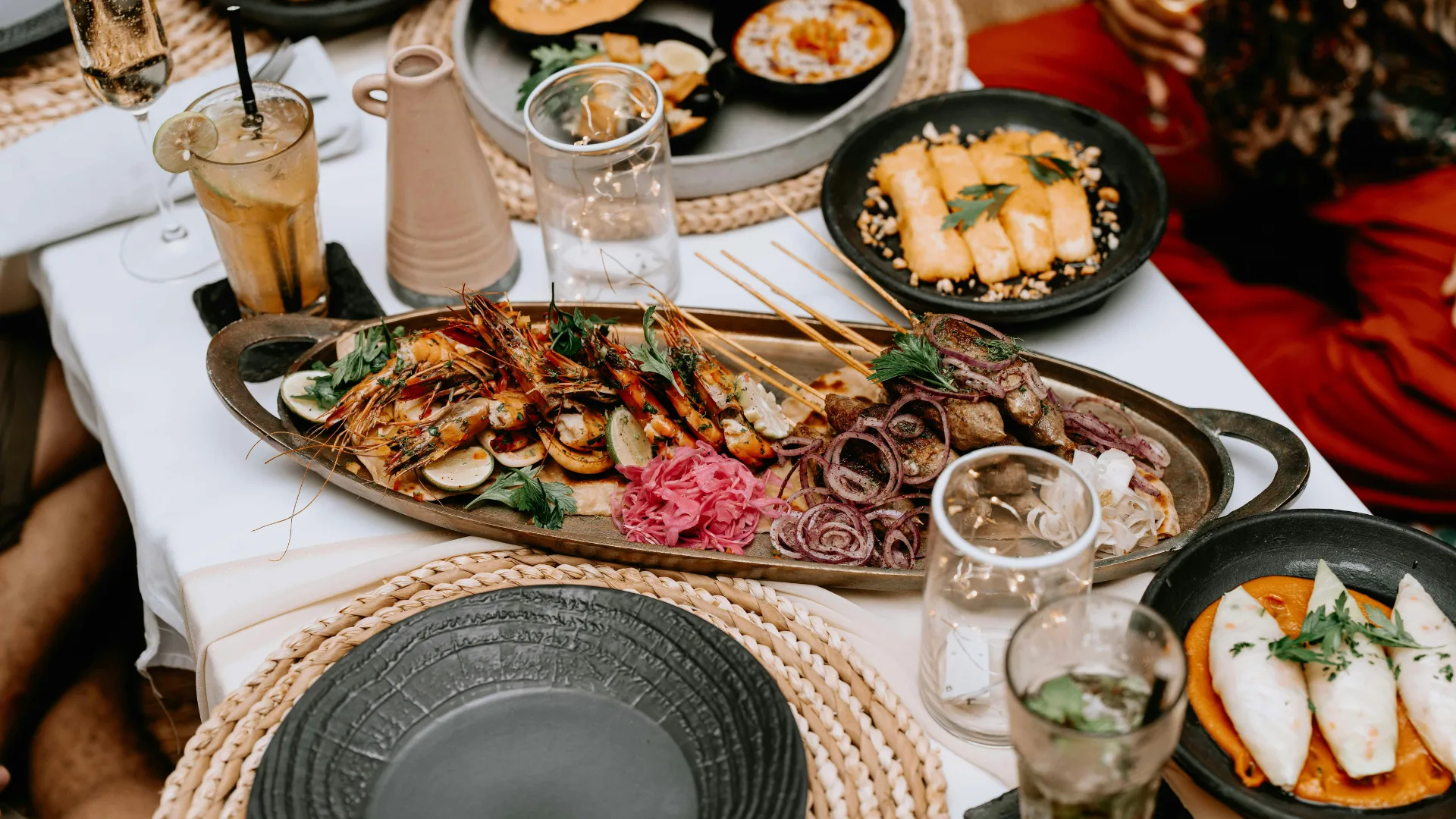 A Swahili coastal seafood platter served at a Tanzanian table